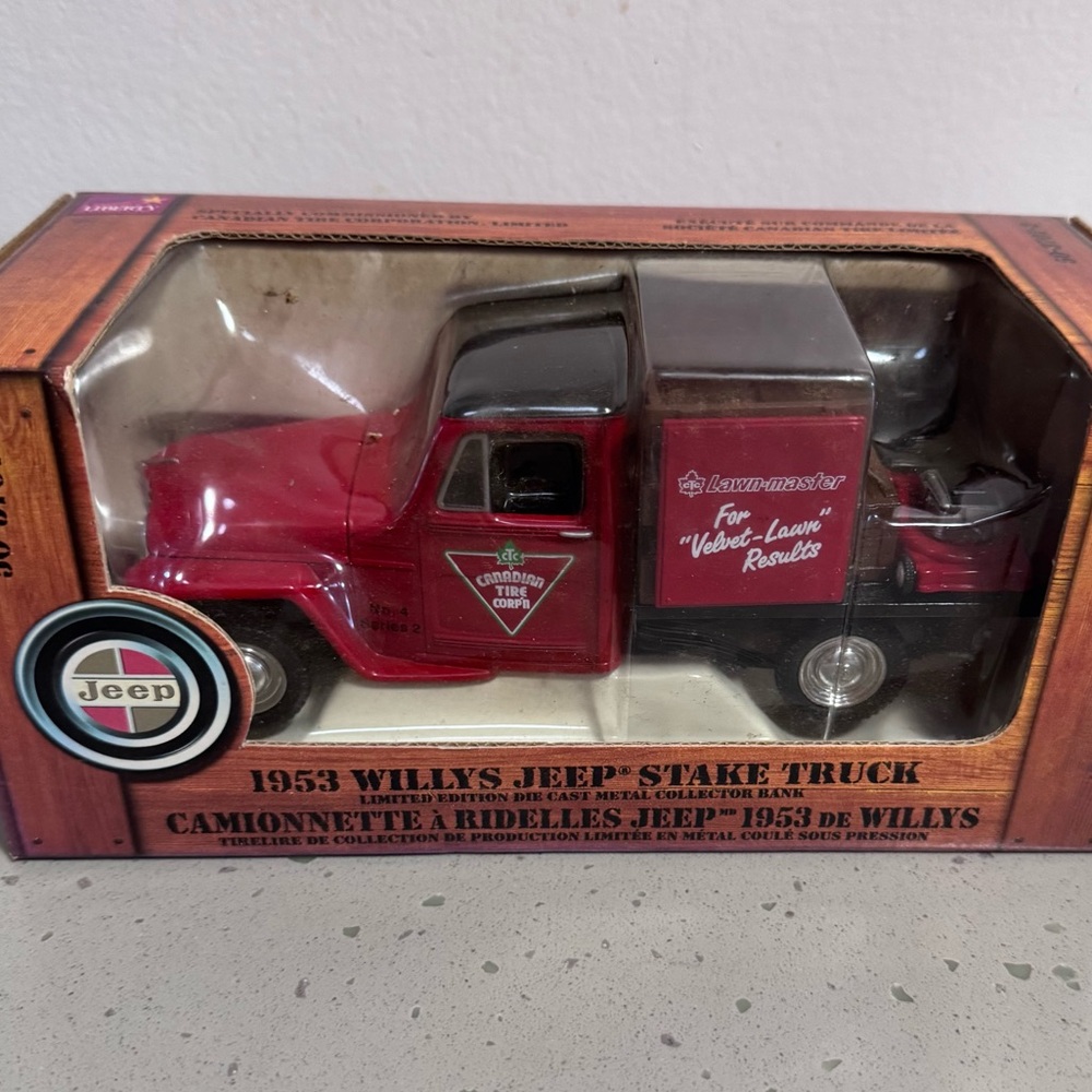 Canadian Tire die-cast metal collector bank of a 1953 Willys Jeep Stake Truck.